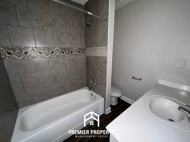 Building Photo - Charming 3BR/2BA Near Southwind | High Vaulted Ceilings, Hardwood Floors & Fireplace