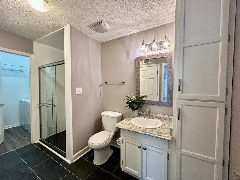 Second bathroom with updated shower - 1101 E Morehead St