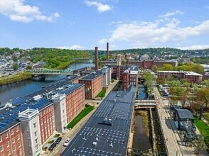 Building Photo - Stylish Industrial Loft with Exposed Brick, High Ceilings & Modern Kitchen
