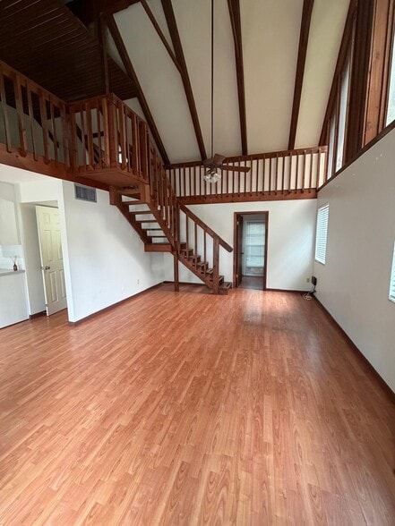 Living area with stairs to loft - 2609 Hillsdale Ave