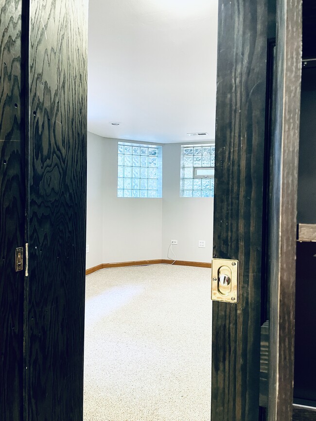 Bookcase pocket door, looking from rec room into Master bedroom - 4259 N Lawndale Ave