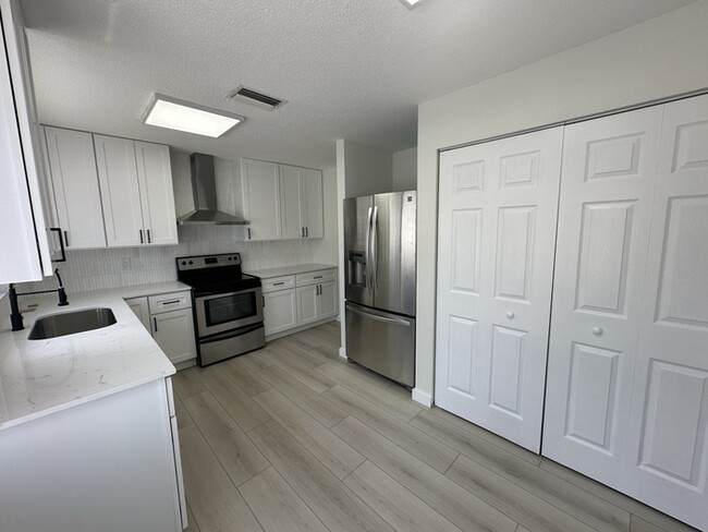 Building Photo - Remodeled 4-bedroom 2 bath 2 car garage in...