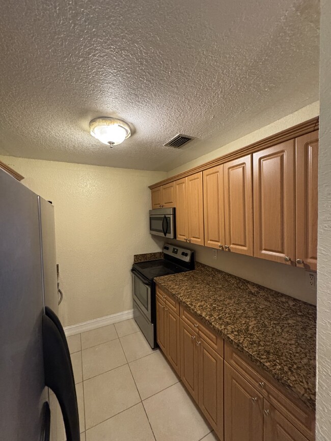 Building Photo - "Charming 1-Bedroom Condo Retreat with Stu...