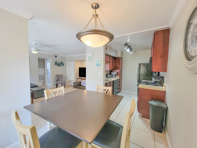 While the floor plan is open and airy, this condo also includes a dedicated dining area. - 3500 N Hayden Rd