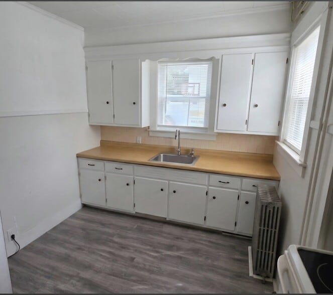 Kitchen with updated faucet - 14 Summer St