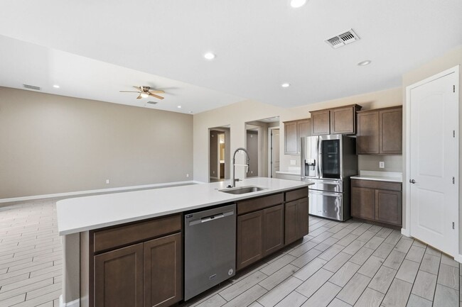 Building Photo - Spacious 5-Bedroom Home with Open Floor Plan & Private Backyard