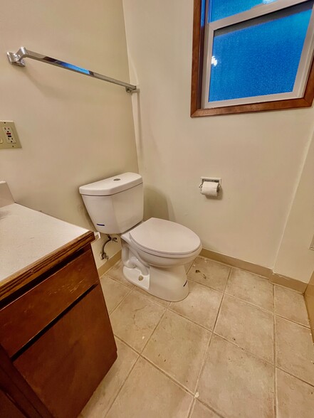 new high efficient toilet - 10042 SW Garrett St