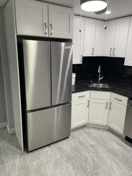 New cabinets granite top and backsplash - 333 Central St