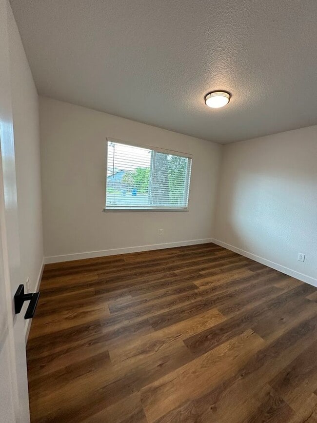 Building Photo - Updated Home with Island Kitchen, LVP Flooring, and Yard Care Included!