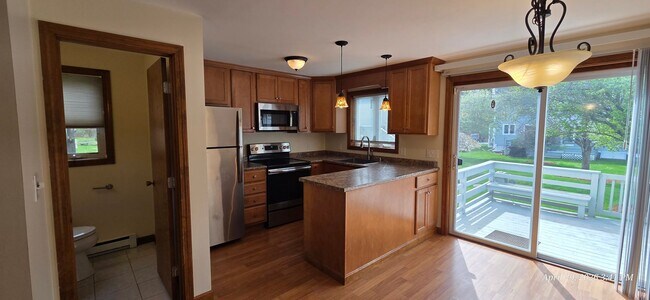 Building Photo - Bright & Spacious 2BR Townhome w/ Finished Basement, Deck & Parking
