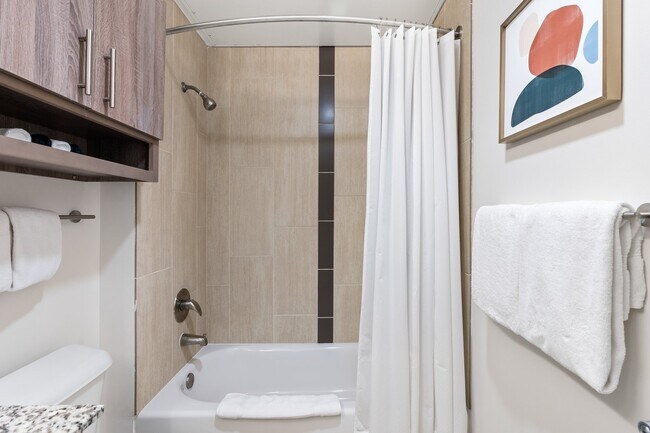 Building Photo - Midtown Magic: Big Savings + Big Perks!