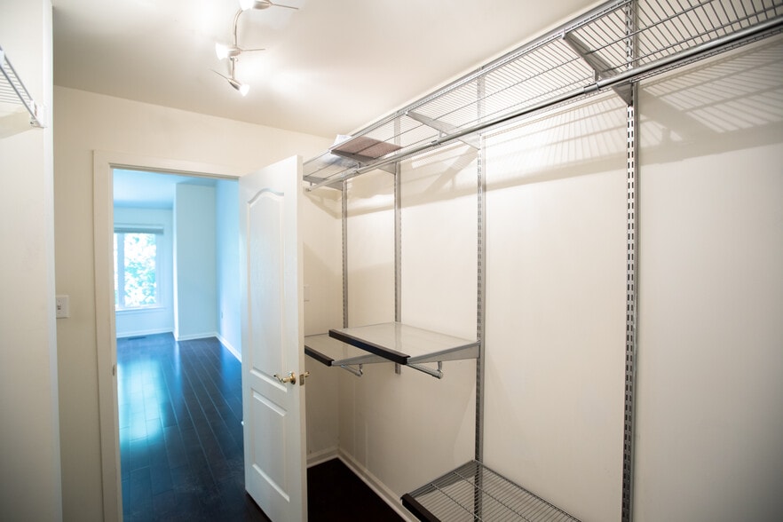 Walk-in closet with Container store Elfa system - 4006 Dogberry Ln