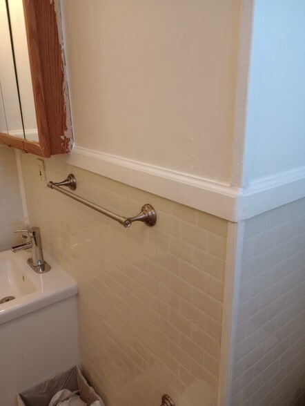 Bathroom grab bar and tile wall - 5655 W Ellsworth Ave