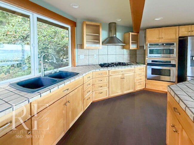 Building Photo - Waterfront Rustic Retreat with Vaulted Ceilings, Picture Windows & Lofted Nook