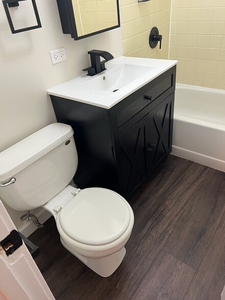 bathroom: new flooring, vanity, and finishes - 2446 W Thomas St