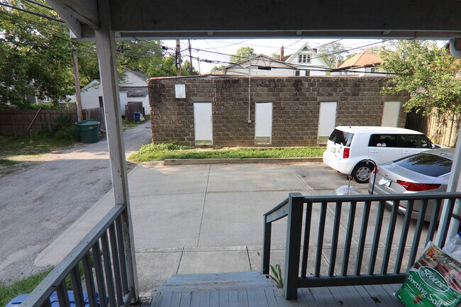 View of parking lot and garages from kitchen rear door - 372 E Oakland Ave