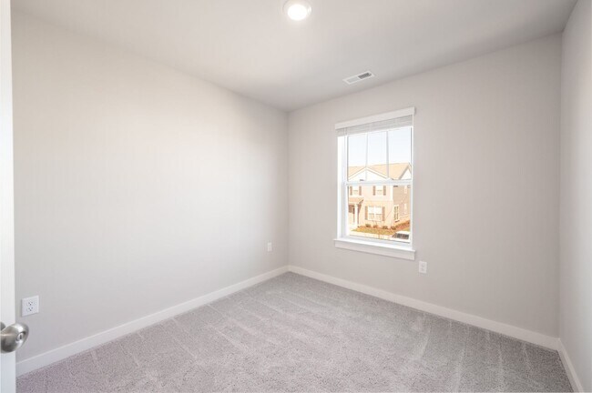 Building Photo - **BE THE LUCKY ONE TO LIVE IN THIS 2022-BUILT END-UNIT TOWNHOME IN BLACKMAN STATION**