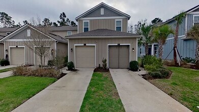 Building Photo - Jacksonville Townhome w/ Garage, Spacious Bedrooms & In-Unit Washer/Dryer