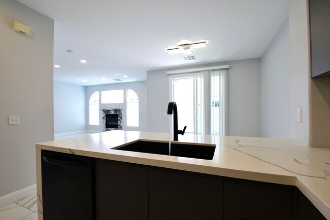 Building Photo - Charming Mediterranean-Style Townhome in G...