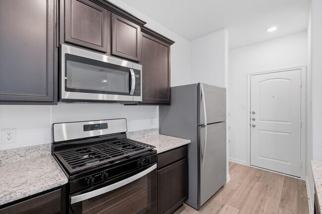 Building Photo - Clean & Modern Townhome with No Carpet and Lawn Service Included