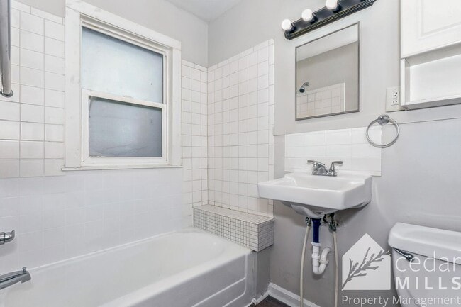 Building Photo - Updated, clean unit, with LARGE basement for storage!