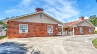 Building Photo - Unfurnished/Annual Rental 1br/ba/1 carport...