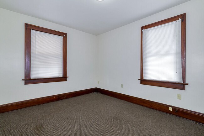 Building Photo - Charming 3BR Home with Classic Woodwork, Porch & Bonus Attic Space