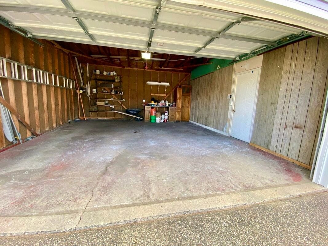 2-Car Attached Garage 2 Spacious with built-in shelving and interior access - 710 Sheridan Avenue North