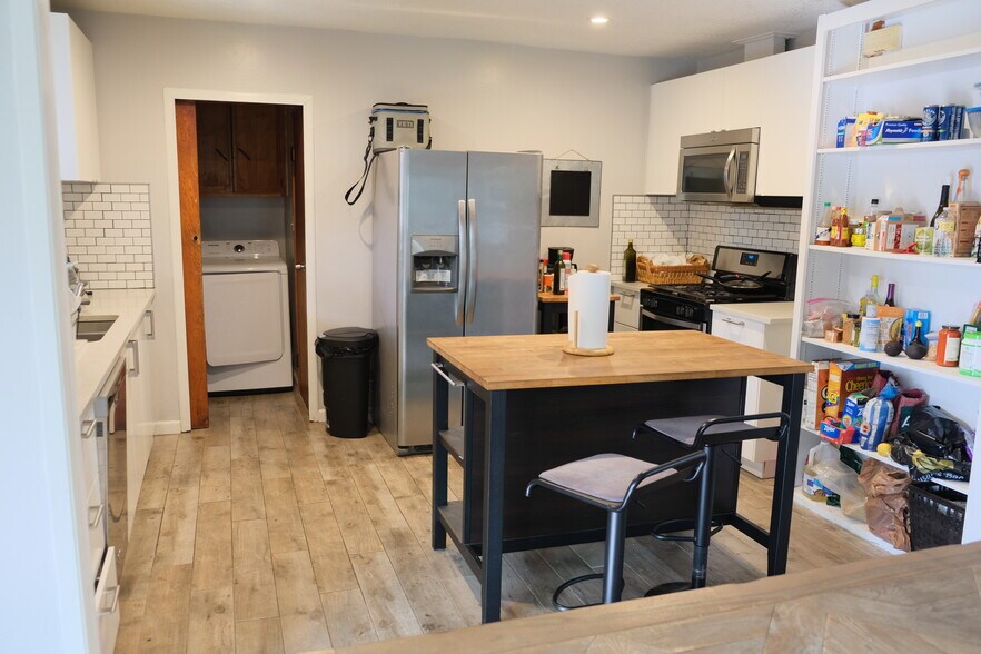Kitchen with large refrigerator - 1243 N Alexandria Ave