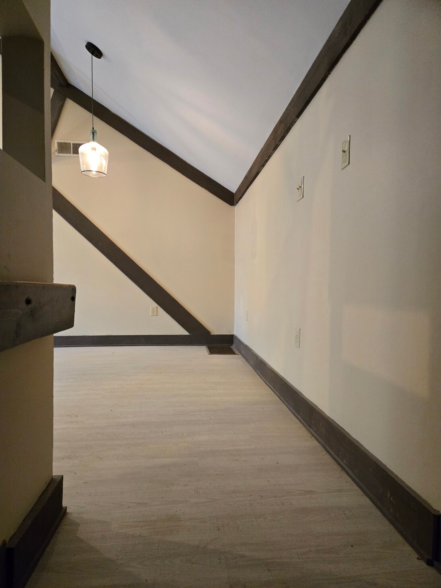 Landing at top of stairs looking into living area - 60 W Winter St