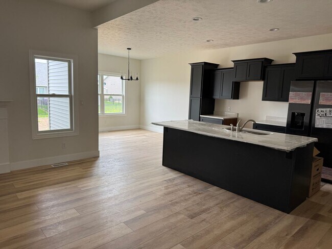 Building Photo - New Construction! West side location. 4br, 3bth, 2crg, Finished basement. All new stainless steel...