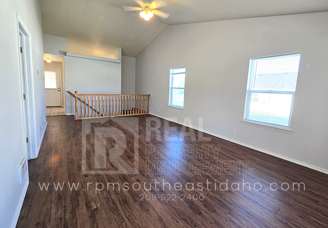 Building Photo - Spacious & Updated 2 Bedroom, 2 Bathroom Twin Home in Ammon with Garage, Fenced Backyard, and Hoo...