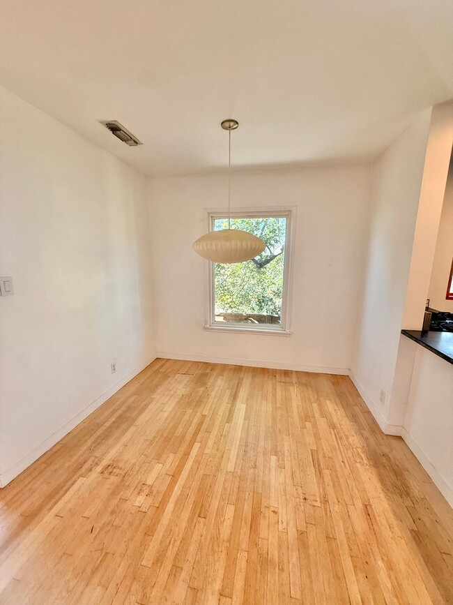 Building Photo - Hilltop Highland Park Sanctuary with Views, Private Gated Yard, In Unit Laundry, Parking & Abunda...