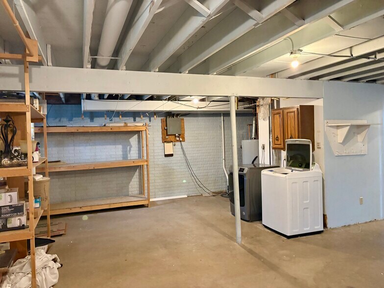 Washer and dryer included in unfinished lower level - 3885 Tam O Shanter Dr N