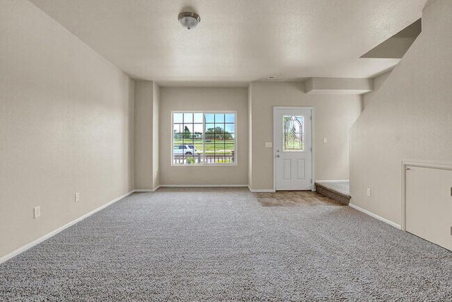 Building Photo - Modern Townhome with Central A/C, 2-Car Ga...