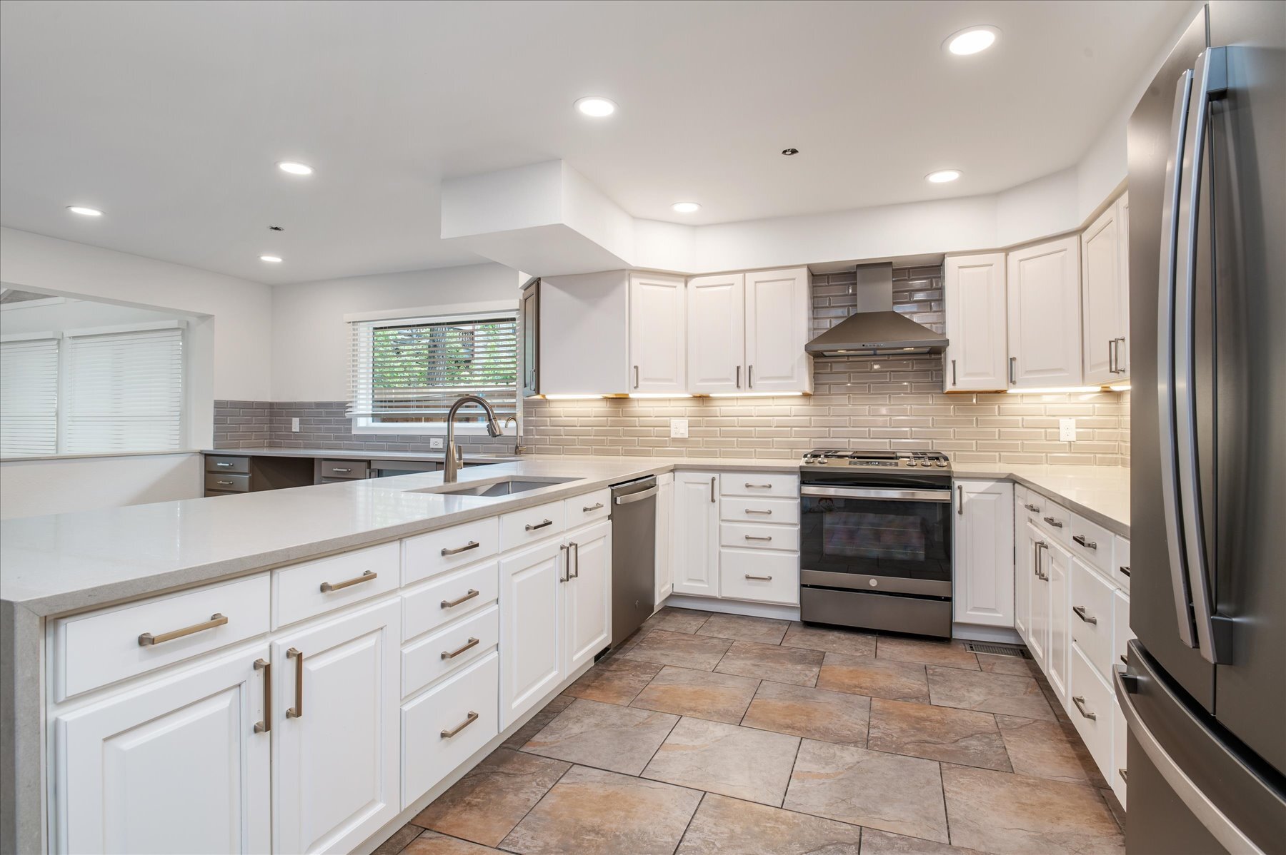 Kitchen featuring quartz counters and upgraded appliances - 1836 19th St