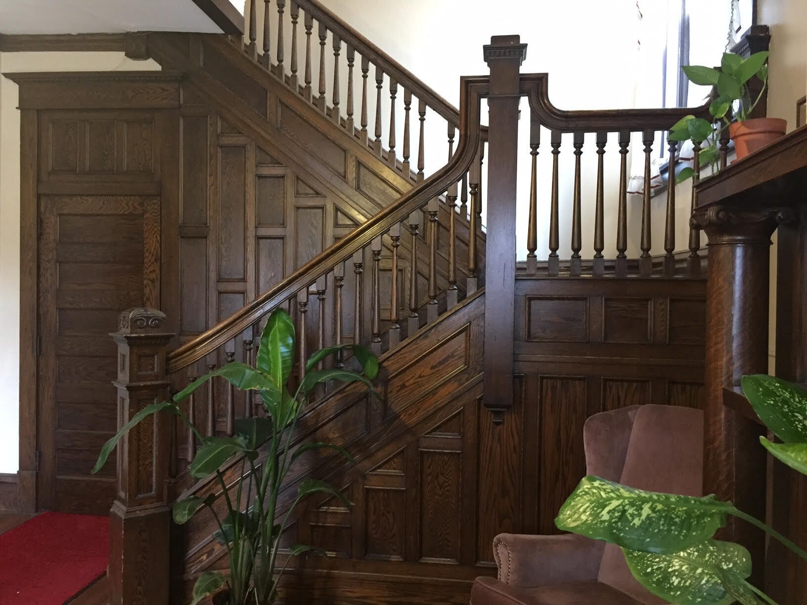 Gracious common area entry features ornate, original wood paneling and decorative fireplace. All apartments have separate entrances. Main staircase leads to Apartment 2 on the 2nd floor - 350 Cobun Avenue