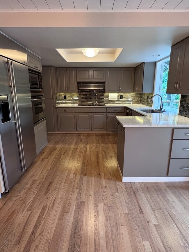 Building Photo - Spacious 4 Bed Home Backing to Private Woodland Trails! Finished Basement, Large Deck, Office, Pe...