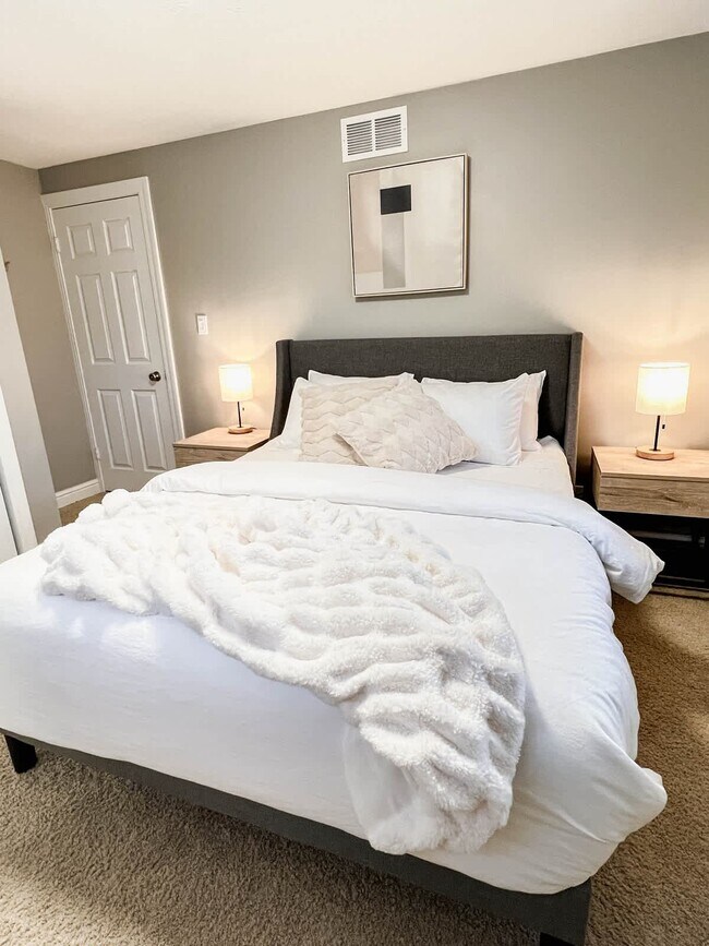 Bedroom 2- Queen-sized mattress with two nightstands and bedside lamps with USB charging hubs. This - 1237 Giesse Dr