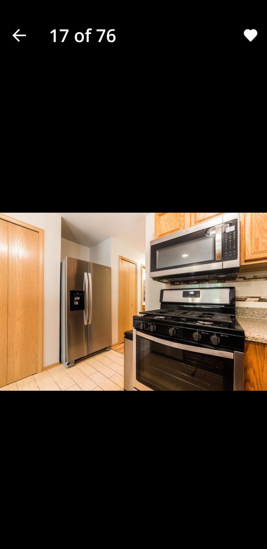 Stainless Steel refrigerator and full wall pantry - 949 Constance Ln