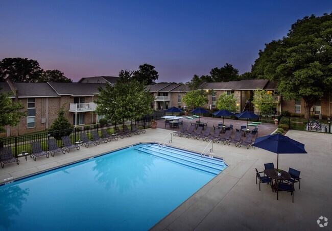 Resort-style pool at dusk - Plainview Apartments