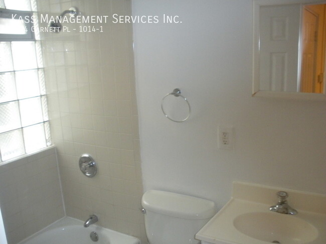 Building Photo - Very Spacious Duplex Apartment features 4 ...