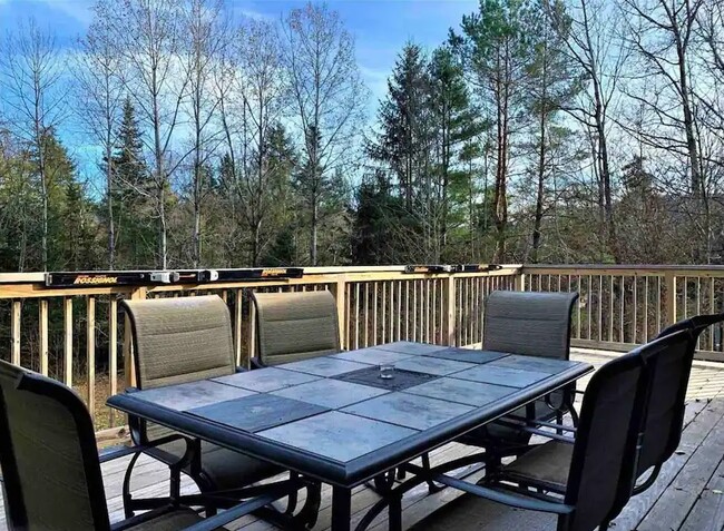 Deck with table located just outside of the Dining room & Kitchen - 94 Brookside Dr