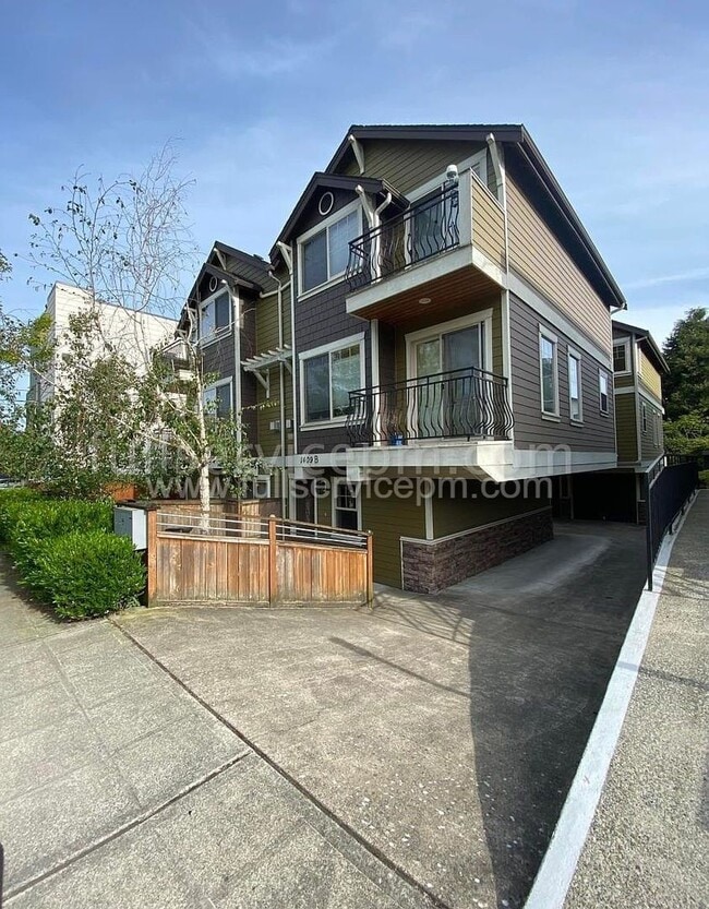 Building Photo - Spacious townhome with private backyard, garage parking, multiple decks, and a dedicated home off...