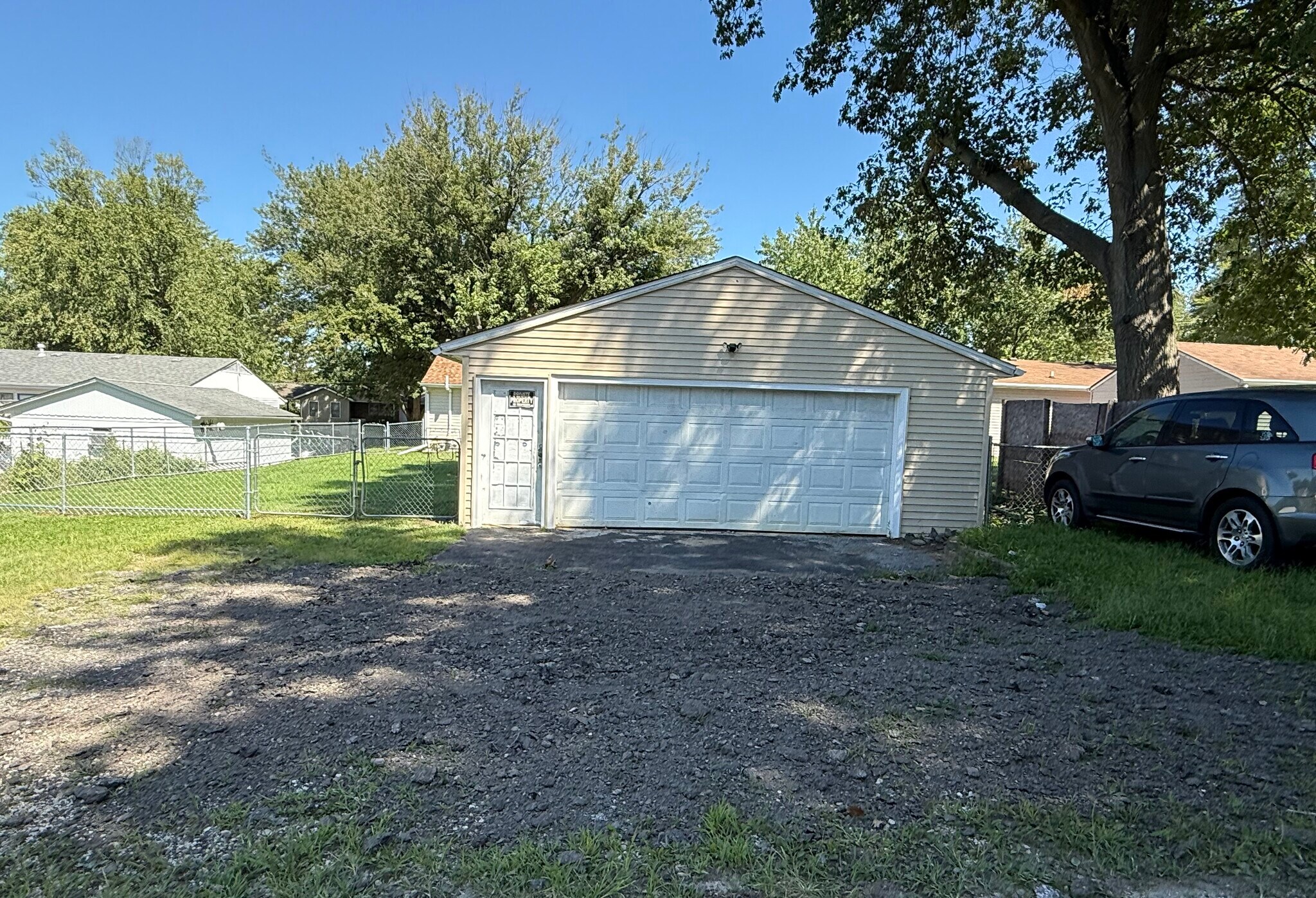 Detached garage and additional parking and fenced backayard. - 1444 Dodge St