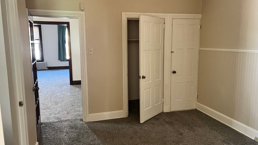 Looking from the bedroom towards the front two rooms which could be used for living areas and our of - 560 Walnut St