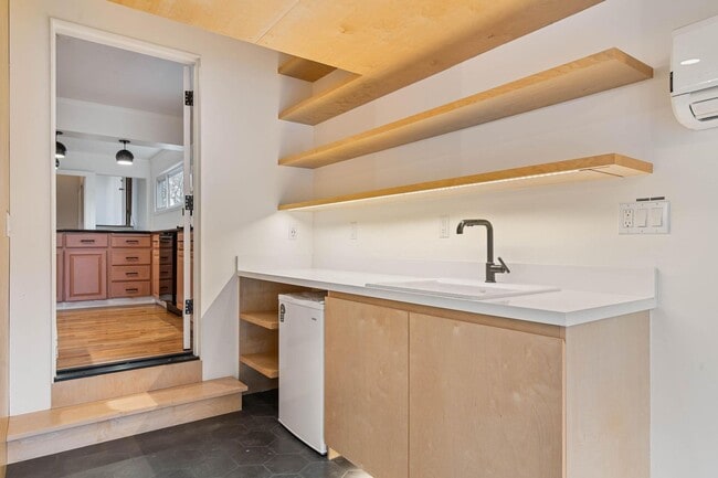 Building Photo - Beautiful, modern 4-bdrm/2-bath home in Concordia—Private, urban sanctuary w/ flex spaces