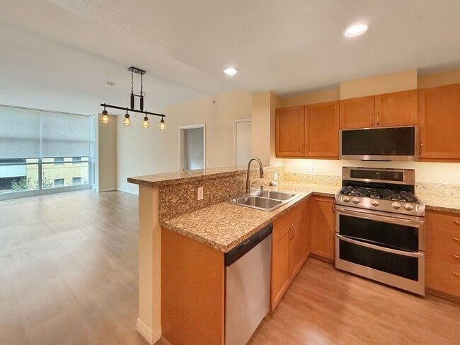 Building Photo - Newly Remodeled 2B/2BA condo w/ Reserved P...