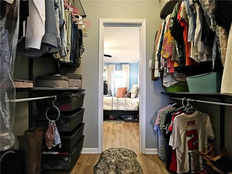 walk in closet with two doors (one to bedroom and one to bathroom) - 1101 Collier Rd NW