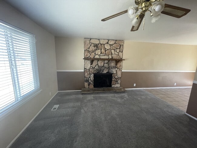 Building Photo - Spacious 6-Bed Oasis with Finished Basement & Cozy Fireplace.